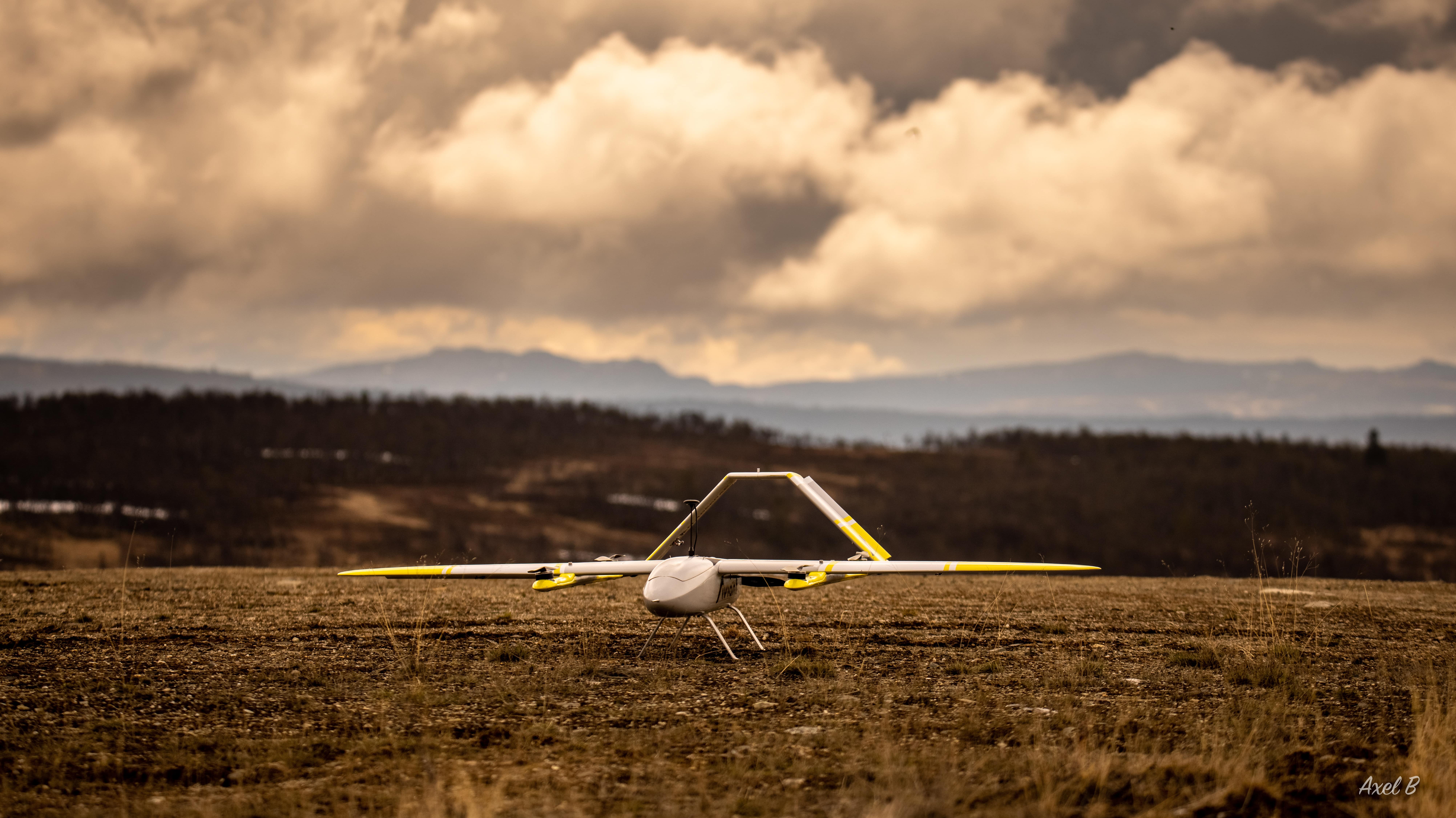 An image of a drone on the ground, ready to take off